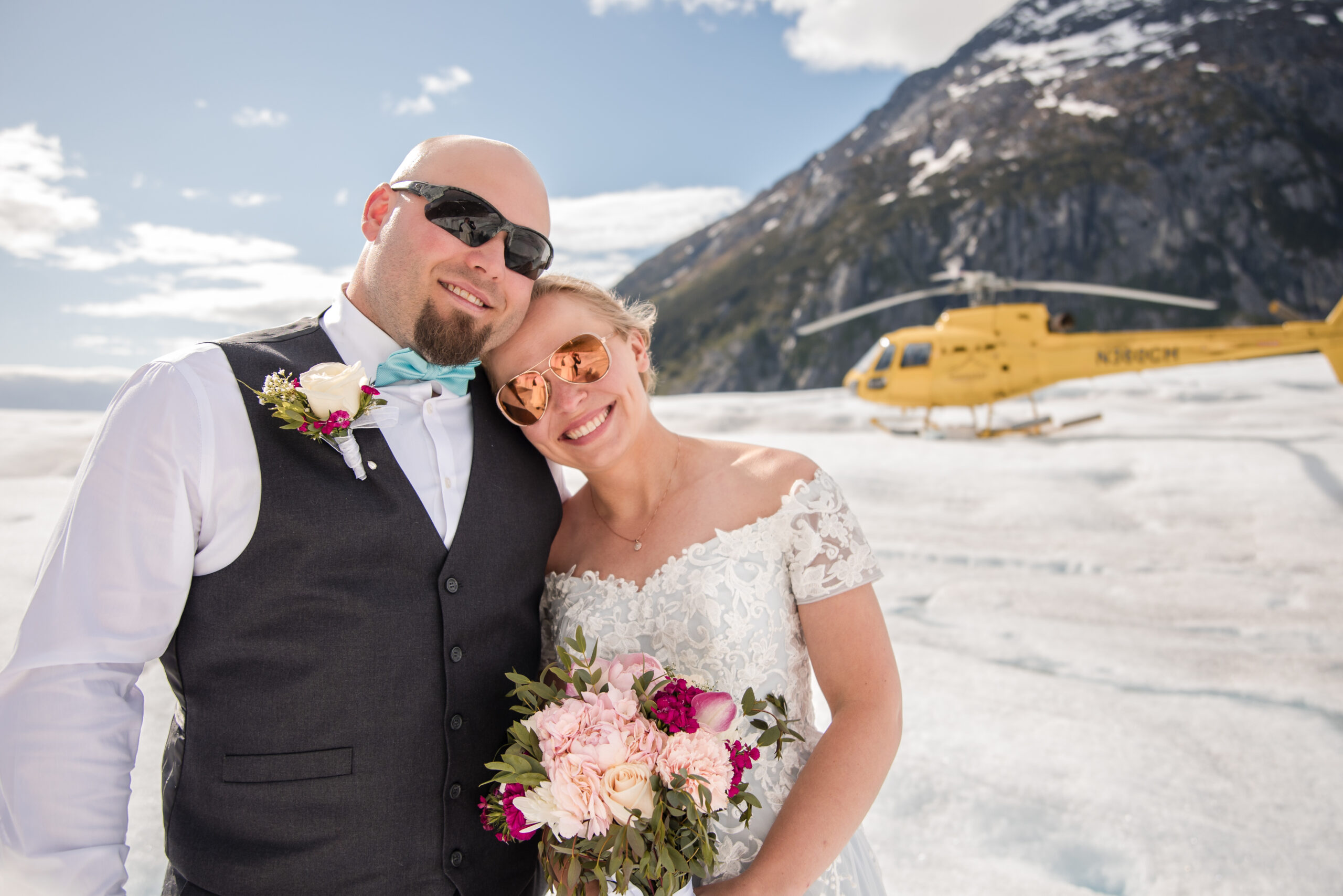 Couple poses as newlyweds on a glacier in Alaska after they eloped