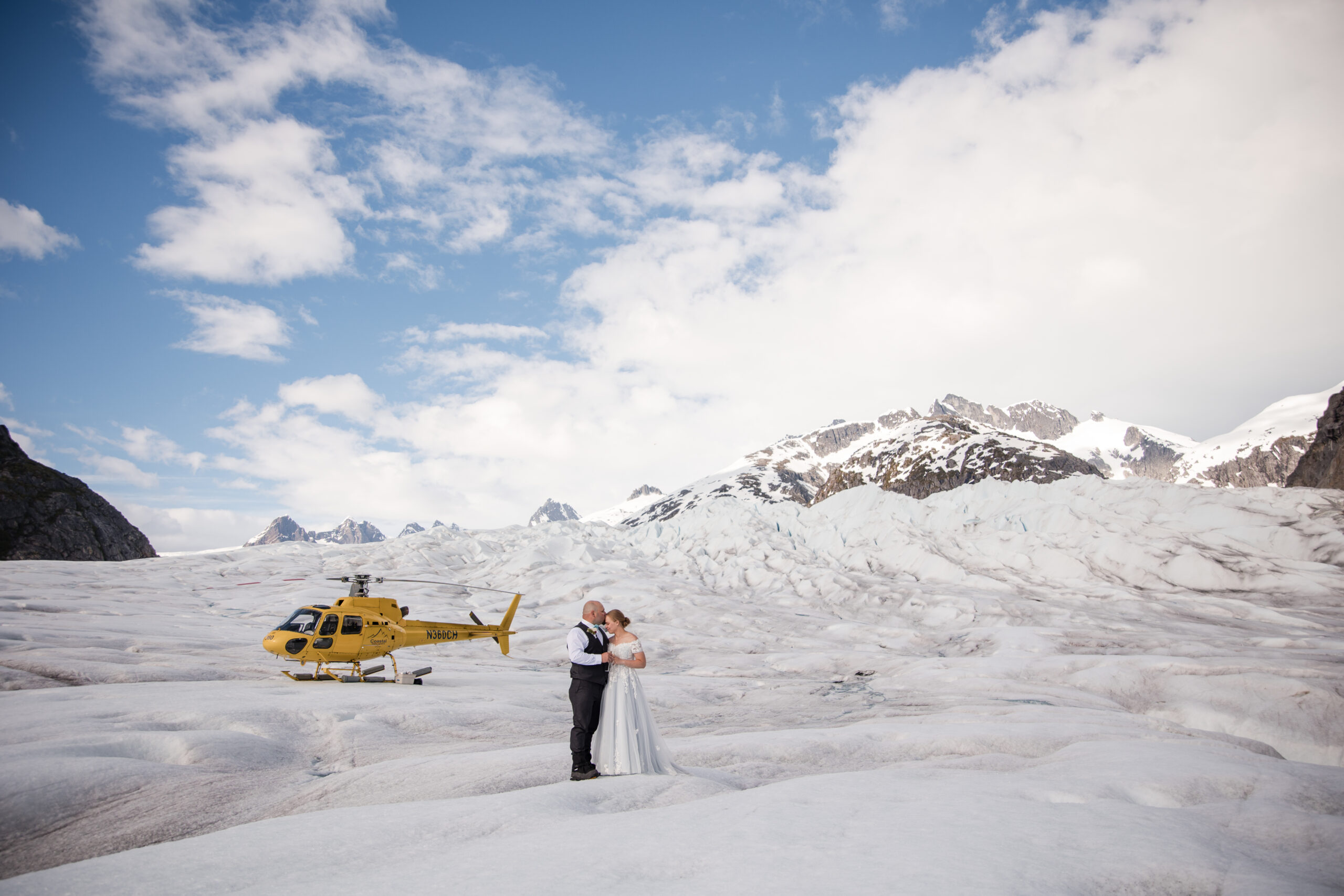 Couple spend quiet time together on top of Herbert Glacier in Juneau Alaska during their Alaskan glacier elopement